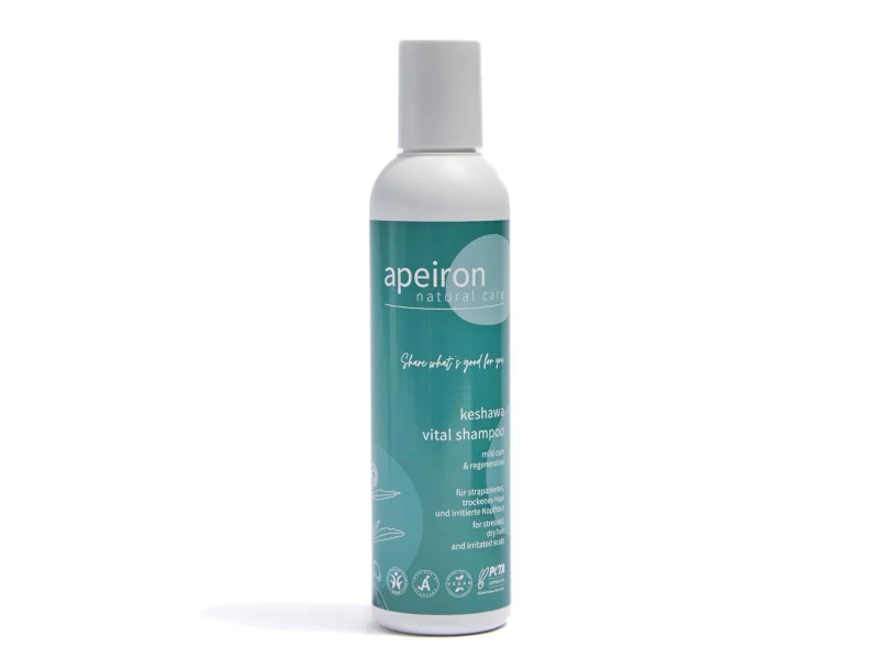 Bottle of Apeiron Keshawa Vital Shampoo for dry hair featuring a teal label and natural care branding