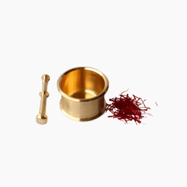 Brass mortar and pestle with freshly ground saffron