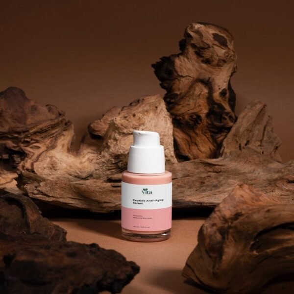 Peptide Anti-Aging Serum bottle photographed on desert rock